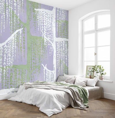 Modern bedroom with a large window and decorative wall mural featuring a willow tree illustration in white and green over a light purple background - willow tree wallpaper